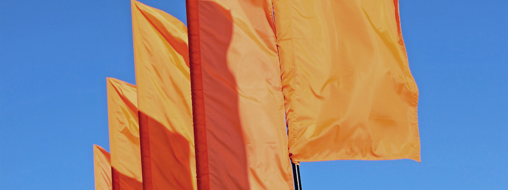 Orange flags blowing in the wind